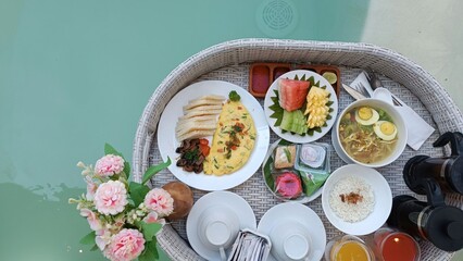 Colorful Floating Breakfast Spread with Exotic Dishes by Pool