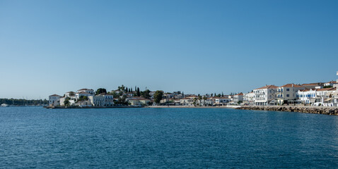 Fototapeta premium Spetses island, Greece. Seafront buildings view from the sea