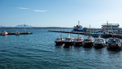 Fototapeta premium Spetses island, Greece. Motor boats taxis anchored at small port of Dapia