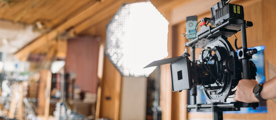 Professional film and video camera on the set. Shooting shift, equipment and group.