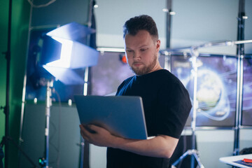 Director at work on the set. The director works with a group or with a playback while filming a...