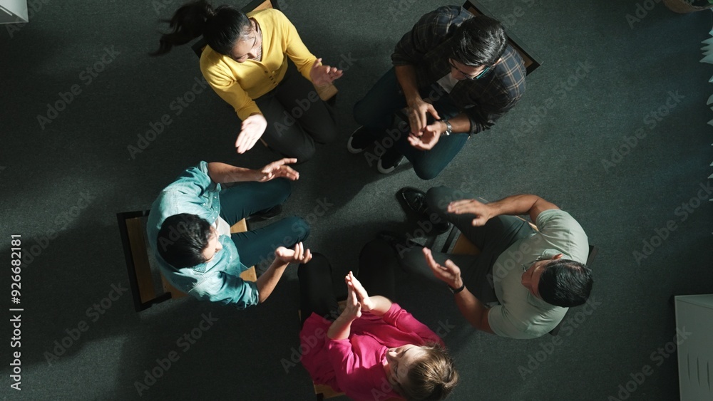 Poster Top down aerial view of business people clap hands together to celebrate successful project while sitting chair circle. Aerial view of skilled marketing team applause successful project. Symposium.