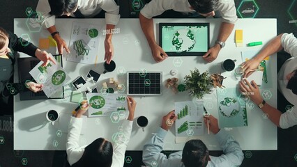 Top view of business team discussing about using clean energy and sustainable investment at meeting...