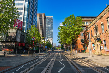 Broad street with tram tracks at downtown of Birmingham city. England