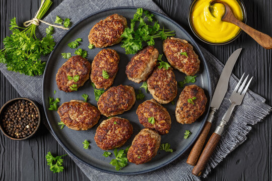 frikadeller, danish meatballs on a plate, top view