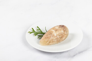 Cold appetizer. Chicken jellied meat in the shape of a quenelle. Copy space