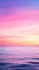Soft pastel sunset over the calm ocean, with gentle hues of pink, purple, and blue blending in the sky. The tranquil scene captures the serene beauty of nature.