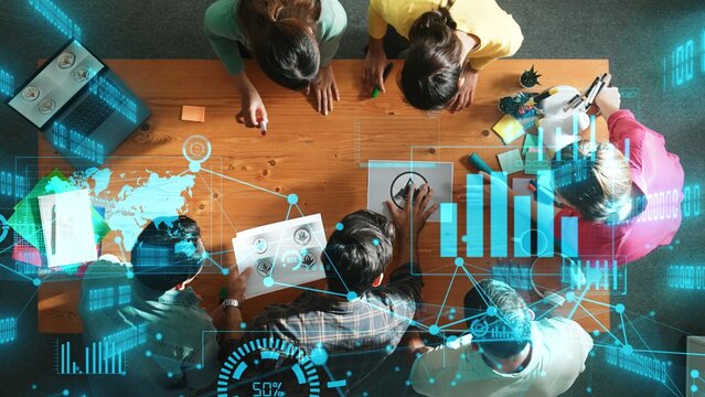 Top view of skilled business team put graphic logo on meeting table with colorful sticky notes and start to design while explain idea. Smart project manager explain about financial graph. Symposium.