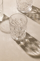 empty glasses on beige background