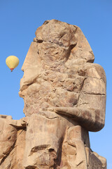 Famous Colossi of Memnon. Massive ruined statues colossi of the Pharaoh Amenhotep III. Travel and...