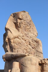 Famous Colossi of Memnon. Massive ruined statues colossi of the Pharaoh Amenhotep III. Travel and...