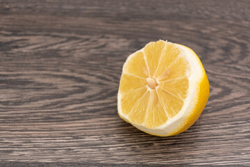 Sliced ​​lemon on wooden table, copy space