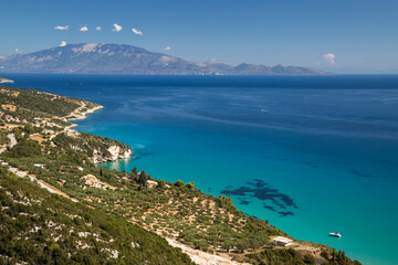 Greek bay in the summer sun with sea and island