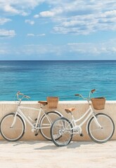 Fototapeta premium Two vintage bicycles with baskets leaning against a textured peach wall