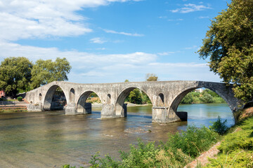 Fototapeta premium The famous stone bridge over the river Arachthos, in Arta, Greece