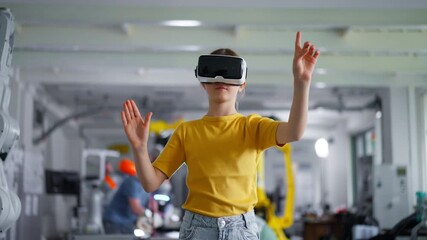 Video of schoolgirl with VR headset on head. Children learning robotics in Elementary school, using modern technology, virtual reality. - Powered by Adobe