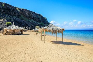 Sable Blanc sand beach resort with straw huts and turquoise sea, Tajourah region, Djibouti, Horn of...