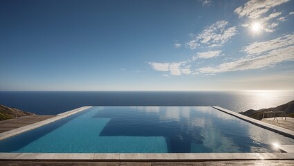 Fototapeta na wymiar Infinity edge pool with a vast ocean view under a clear blue sky.