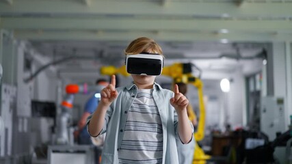 Video of schoolboy with VR headset on head. Children learning robotics in Elementary school, using modern technology, virtual reality. - Powered by Adobe