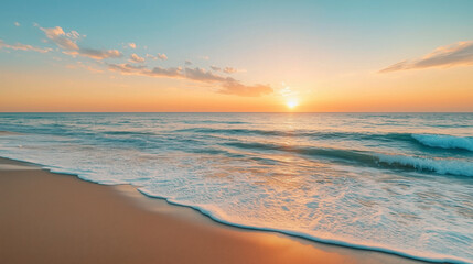Obraz premium A peaceful beach at sunset, featuring gentle waves washing onto the shore, under a colorful sky with soft clouds