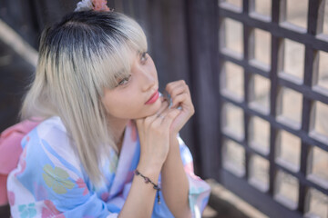 Pretty girl in a Yukata dress.  A young Asian woman wearing a traditional Japanese kimono or Yukata...