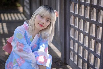 Pretty girl in a Yukata dress.  A young Asian woman wearing a traditional Japanese kimono or Yukata...