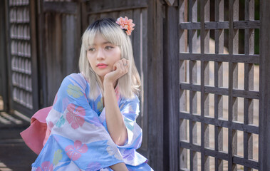 Pretty girl in a Yukata dress.  A young Asian woman wearing a traditional Japanese kimono or Yukata...