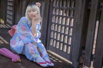 Pretty girl in a Yukata dress.  A young Asian woman wearing a traditional Japanese kimono or Yukata...