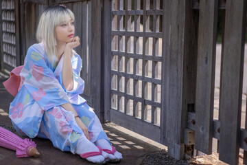 Pretty girl in a Yukata dress.  A young Asian woman wearing a traditional Japanese kimono or Yukata...