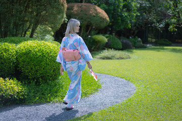 Pretty girl in a Yukata dress.  A young Asian woman wearing a traditional Japanese kimono or Yukata...