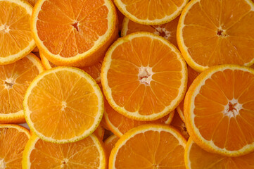 Citrus orange slices on the background. Healthy eating, diet and detoxification concept. Flat lay, top view