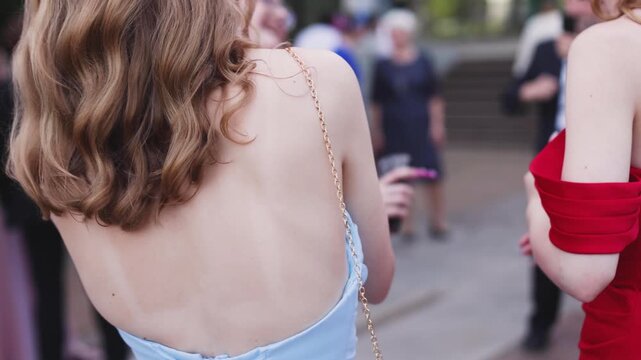 High school graduates dancing on prom, waltz and classical ball dance in dresses and suits on school graduation party, girls and boys classical ballroom dancers, couples dance quadrille and polonaise