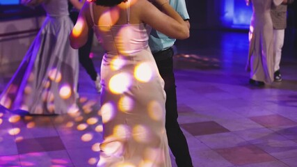 High school graduates dancing on prom, waltz and classical ball dance in dresses and suits on school graduation party, girls and boys classical ballroom dancers, couples dance quadrille and polonaise - Powered by Adobe