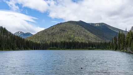 Beautiful waters of the Lightning Lake at Manning Park British Columbia Canada with clouds over the mountains