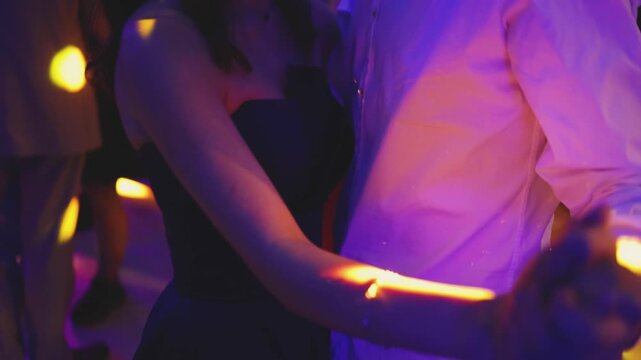 High school graduates dancing on prom, waltz and classical ball dance in dresses and suits on school graduation party, girls and boys classical ballroom dancers, couples dance quadrille and polonaise