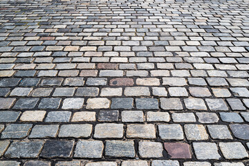 Stone pavement texture. Granite cobblestoned pavement background. Pavement texture.