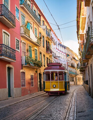Vintage tram on a quaint street in Lisbon under the soft light of day