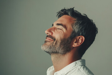 Fototapeta premium A close up of a man's face with her eyes closed