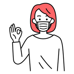 マスクを付けてOKサインをするカジュアルな女性