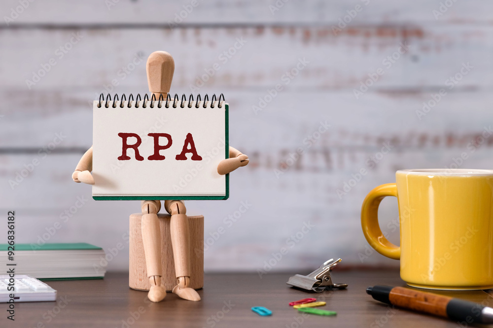 Poster there is notebook with the word rpa. it is an abbreviation for robotic process automation as eye-cat