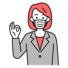 マスクを付けてOKサインをするスーツの女性
