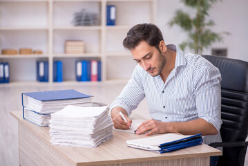 Young male employee working in the office