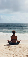 Fototapeta premium Relaxed person meditating on a sandy beach