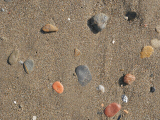 Background of river stone and sand on the beach seashore