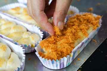 The making of chicken floss bun or bread. Close up.