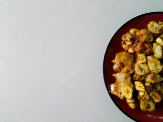 Fried bananas 1
Fried banana snack dish on red plate