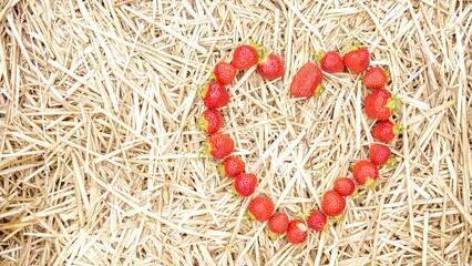 Heart-Shaped Fresh Strawberries on Straw Background Ideal for Valentine s Day or Any Occasion