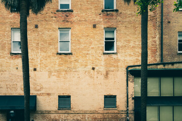 Faded and peeled off brick wall