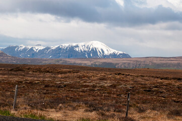 Gullfloss Iceland, view across national park to snow capped mountain on overcast day