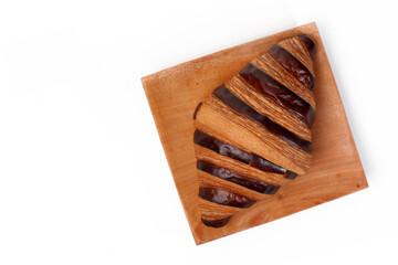 Croissant bread isolated on white background, with chocolate filling